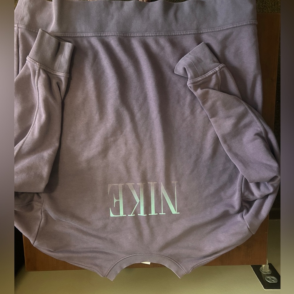 Purple Nike sweater with blue Nike logo